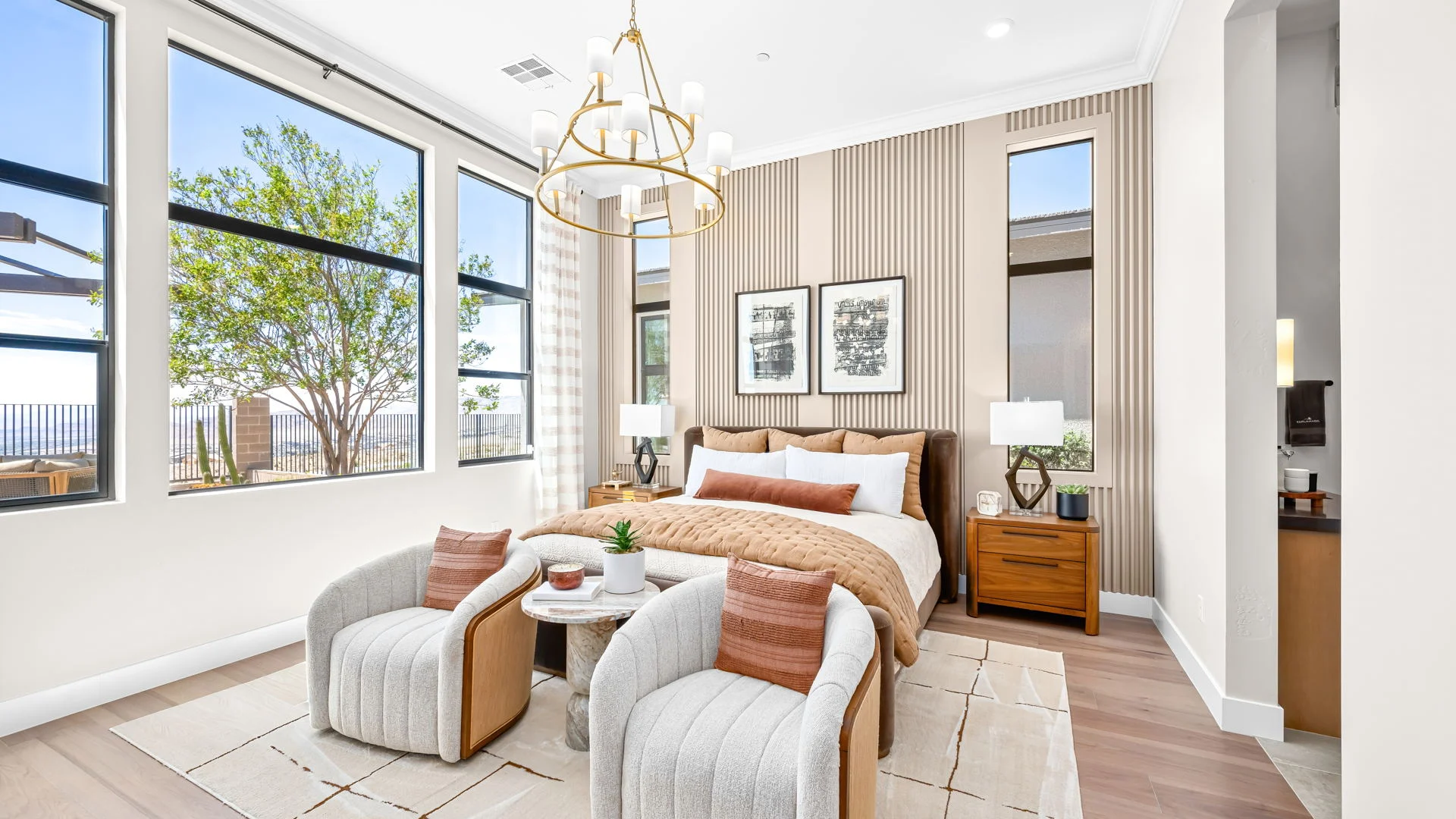 Primary bedroom with soft green accents and hillside views